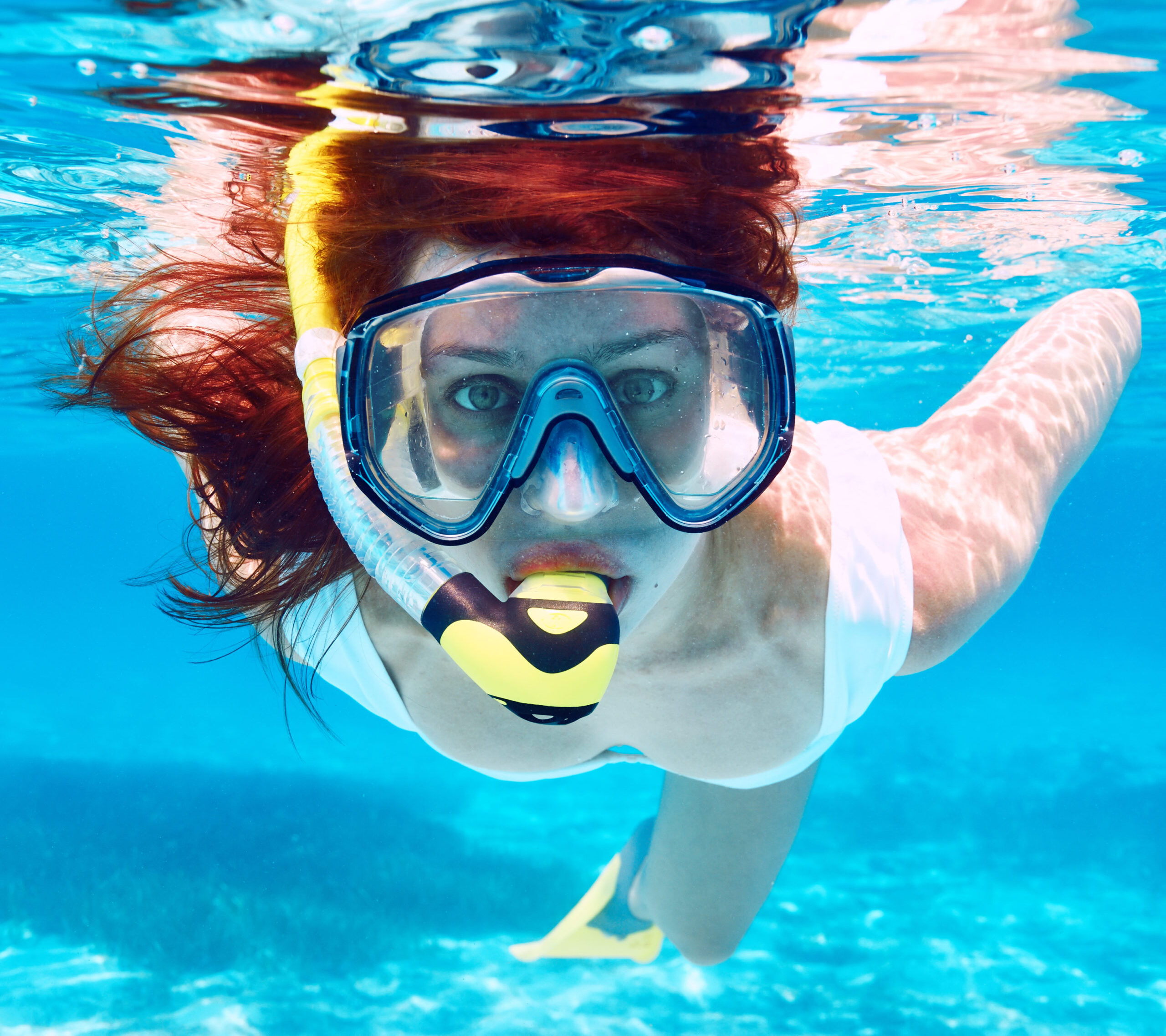 a person swimming in a pool of water