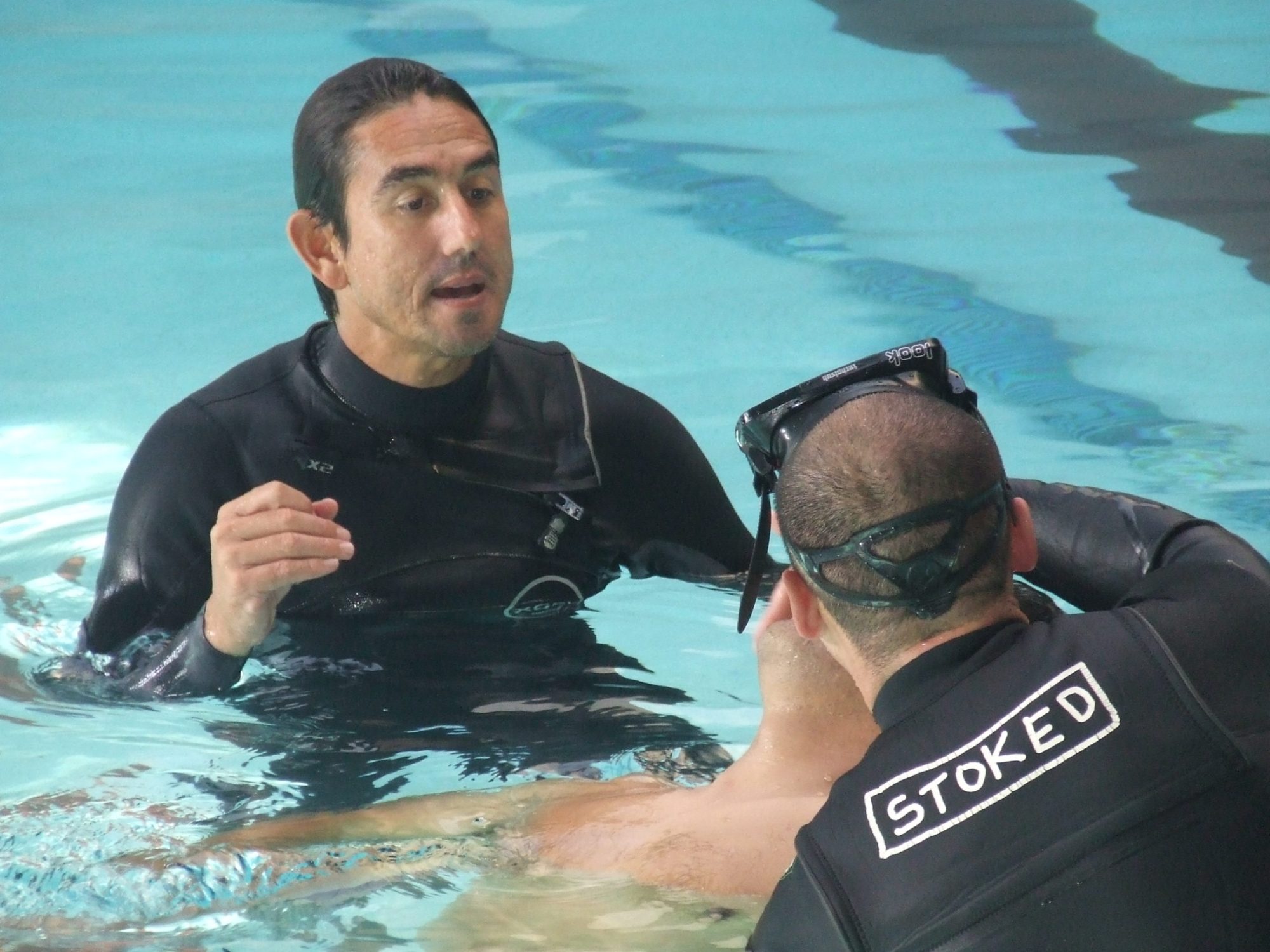 a man swimming in a body of water