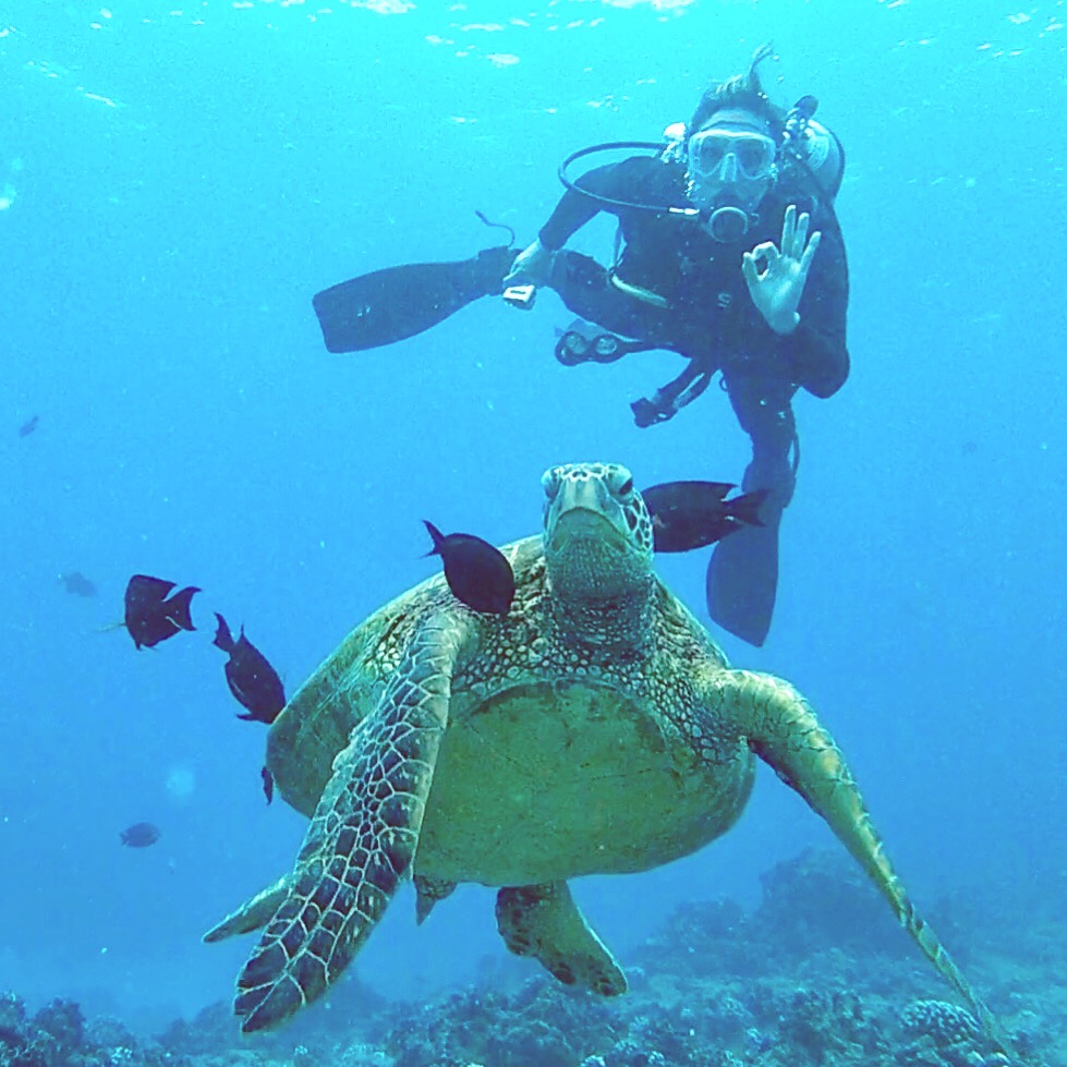 a statue of a person swimming in the water