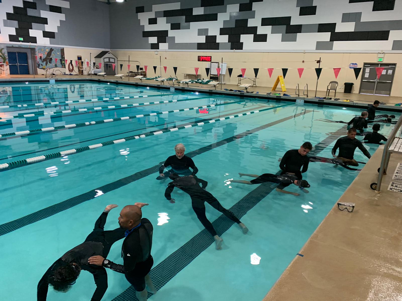 PHOTO-2019-11-22-19-25-22 6 a group of people in a swimming pool