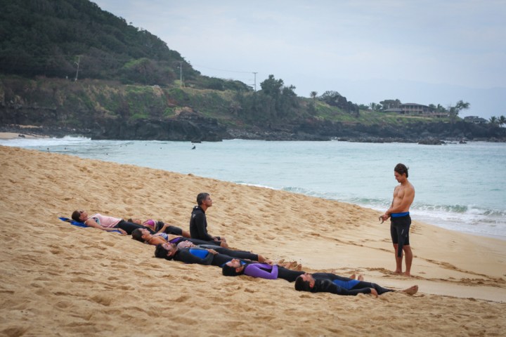 a group of people on a beach