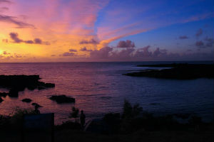 a sunset over a body of water