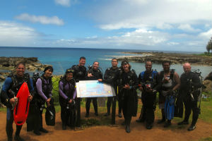 a group of people standing in front of a crowd posing for the camera