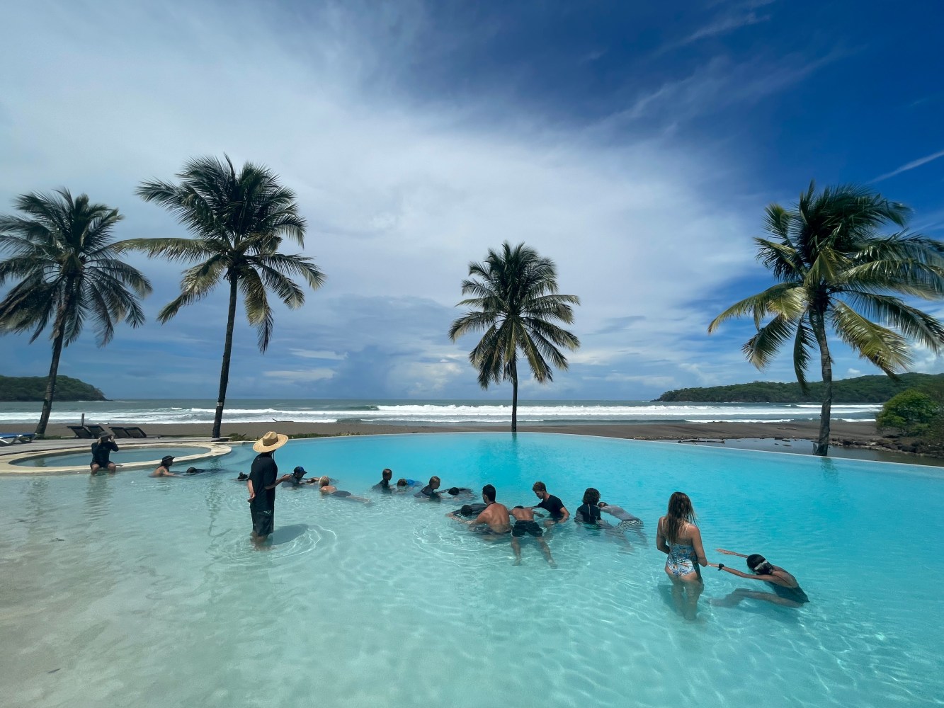 a group of people swimming in a body of water